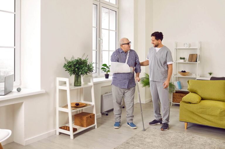 An elderly man exercising to Improve Balance and Prevent Falls with a physiotherapist