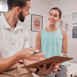 physiotherapist discussing goals with client home