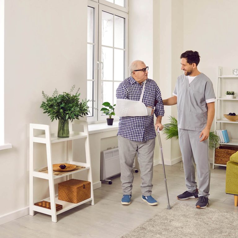 An elderly man exercising to Improve Balance and Prevent Falls with a physiotherapist