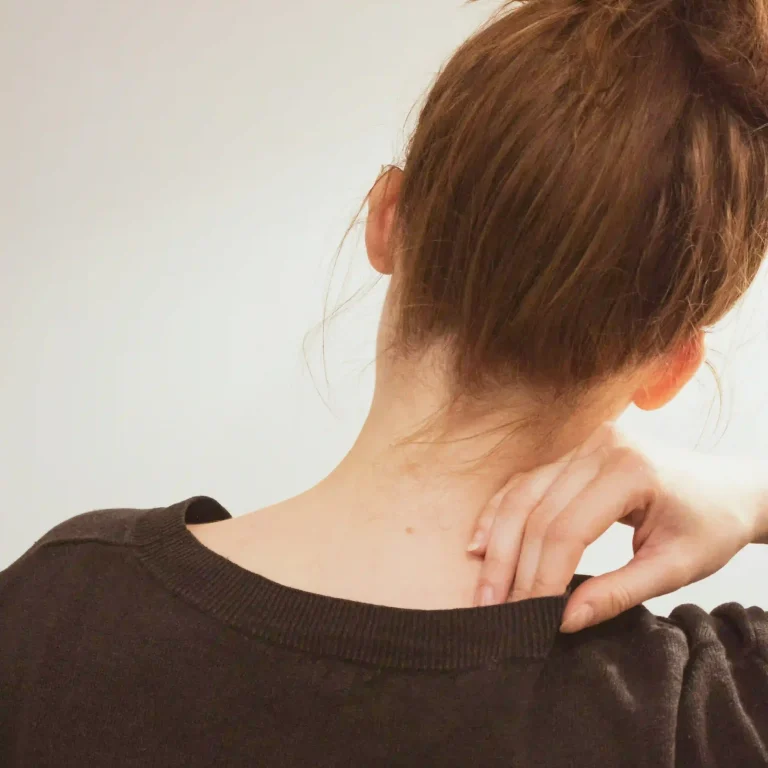 Mobile physiotherapist treating neck pain in a client's home in Sydney